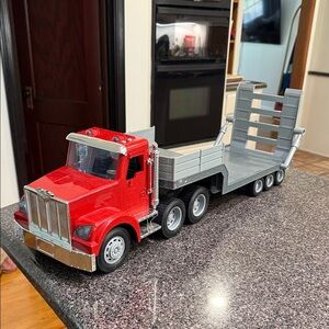Vibrant Red Toy Truck with Silver Trailer